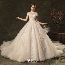 In case if it's too chilly for a strapless dress or you are looking for something comfier to wear, a cap sleeve wedding gown is a perfect solution. Elegant Champagne Wedding Dresses 2019 A Line Princess High Neck Beading Lace Flower Cap Sleeves Backless Cathedral Train