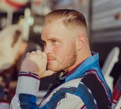 DYK that country music singer Zach Bryan served in the U.S. Navy for seven  years? He opted to serve to continue a family tradition enlisting at the  age of 17. Bryan attained