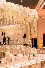 White And Gold Opulent Wedding With Syrian Traditions Flower Centerpieces Wedding Opulent Wedding Tall Wedding Centerpieces
