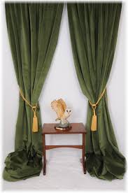 Gorgeous olive green backdrop for the polished living room. Green Velvet Curtains Curtains Living Room Green Curtains Velvet Curtains