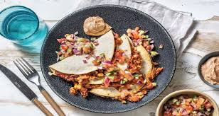 Mexican Cheesy Bean Quesadillas Recipe Hellofresh Recipe In 2020 Recipes Quesadilla Recipes Stuffed Peppers