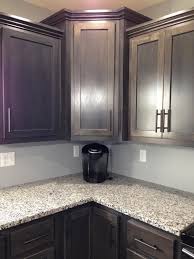The island is a stained maple and cabinets on the perimeter are painted in light grey with charcoal grey tones. Dark Gray Stained Maple Judd S Custom Cabinets Facebook