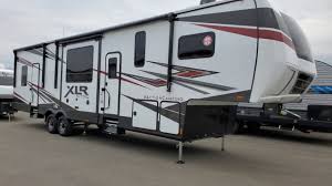 The crossroads of quality and price, offering a practical approach for any usage and a variety of exterior designs from traditional to our toy haulers are ½ ton, ¾ ton and 1 ton towable with additional height and width to make extra room for your toys. 2021 Xlr Nitro 351 14 Garage 3 Slide Out Fifth Wheel Toy Hauler Couchs Rv Nation A Rv Wholesaler Youtube