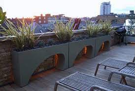 A terrace, which connects to the family room, offers a comfortable spot to enjoy the grounds on a circular sofa by janus et cie. Contemporary Roof Terrace Garden Design By Amir Schlezinger