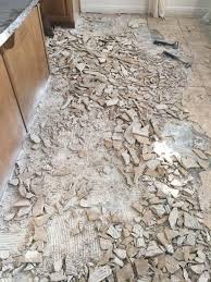How To Remove Tile Flooring Yourself With Tips And Tricks Tile Removal Diy Flooring Diy Remodel