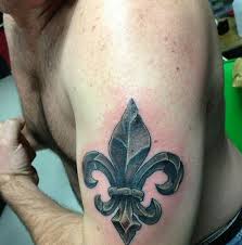 A decorative symbol that appears like a golden flower, but found in all manner of logos, symbols, and patterns. New Fluer De Lis Tattoo New Orleans Saints Saintsreport Com