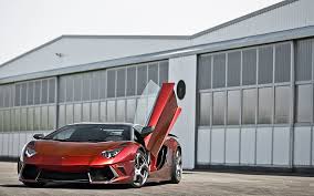 The lamborghini had a very wide base, and a traditional door design would not allow for easy entering and exiting, especially if parked next to anything. Hd Wallpaper Lambo Supercars Tuning Lamborghini Aventador Red Cars Mansory Butterfly Doors 2560x1600 Animals Butterflies Hd Art Wallpaper Flare