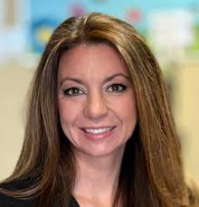 Should a darker background and more wrinkles be added to a painting of a  100-year-old woman?