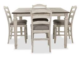 Counter chairs or stools are approximately 24 high, the perfect height for a 36 high or tall table. Realyn Five Piece Counter Height Dining Room Table And Stools Set Mathis Brothers Furniture