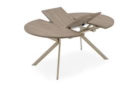 Fixed central metal base with four elliptical sloping legs and butterfly leaf opening with central leaf in the same color as the base. Giove Extendable Dining Table Innoconcept