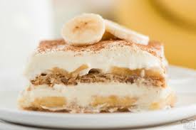 Line a baking dish with lady finger cakes; Caramel Banana Cream Layered Dessert Butter With A Side Of Bread