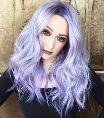 This is a totally cyberpunk take on lilac hair colors, with a dark and smoky underlayer that starts at the roots balancing out the bright lilac and pink tones. 16 Gorgeous Examples Of The Lavender Hair Color Trend Thefashionspot Violet Hair Colors Silver Lavender Hair Hair Color Purple