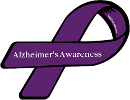 Purple bow in a hand on white background. Alzheimer S Awareness Ribbon World Alzheimer S Day