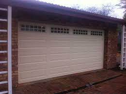 Garage door windows — large areas of glass in a door that may or may not have inserts/grilles. Sectional Ranch Style With Windows Stockton Pattern Pds Garage Doors Gates