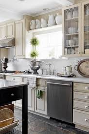 Above Cabinet Idea Pitchers And Tall Receptacles Bought From Thrift Stores And Spray P Above Kitchen Cabinets Kitchen Decor Decorating Above Kitchen Cabinets