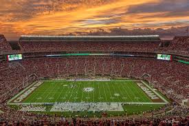 the sun sets at bryant denny stadium alabama crimson tid