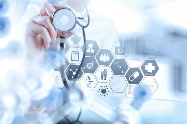Doctor holding a stethoscope in front of a medical icon grid