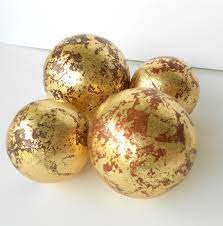 When filling a larger container, mix them with other shapes, sizes, and colors of decorative fillers. Set Of 4 Decorative Spheres Distressed Balls In Gold Leaf Centerpiece Gold Decorative Balls Different Sizes Balls Decorative Spheres Gold Decor Spheres