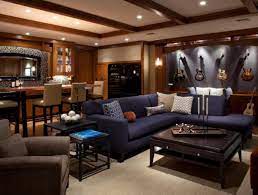 For a complete cinema experience, create a snack bar in the back with a popcorn machine and line the walls with your favorite movie posters. Man Cave Ideas Inspirations Essential Home