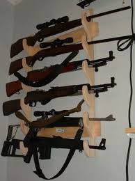 Offers these locking, vertical wall gun racks. Gun Racks