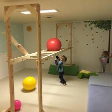 For kids who want a little more adventure, there's a fireman's pole and a 9 ft. Diy Basement Monkey Bars Just In Time To Keep The Kids Active This Winter The Height Is Adjustable So We C Kids Room Murals Kids Playroom Indoor Monkey Bars