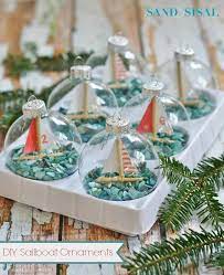 You can combine the warm coast with that wonderful holiday feeling. Diy Sailboat Ornaments Sand And Sisal Beach Christmas Decorations Beach Christmas Tropical Christmas