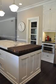 Island Like The Split Marble Granite Butcher Block Surface And The Pull Out Drawers For Trash Rec White Zen Kitchen White Kitchen Remodeling Zen Kitchen