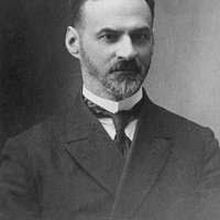 A black and white photo of a man with a beard. Ernest hemingway author  journalist.