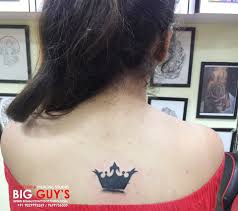 Grey ink queen band tattoo on upper back. Cutest Small Queen Crown Tattoo Done Back Shoulder Bladder Of Girl At Big Guys Tattoo Studio Tattoos Queen Crown Tattoo Tattoos On Back