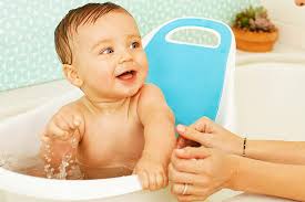 Baby taking bath in kitchen sink. Top 10 Sink Baby Baths Recommended On Baby Advice Websites Baby Bath Moments