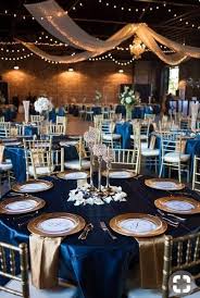 Top 8 Striking Navy Blue Wedding Color Palettes For 2019 Fall Navy Blue And Gold Table Set Blue Wedding Decorations Blue Gold Wedding Blue Wedding Receptions