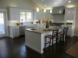 Small southwest galley brick floor and wood ceiling kitchen photo in phoenix with an undermount sink, shaker cabinets, dark wood cabinets, quartz countertops, multicolored backsplash, cement tile backsplash, stainless steel appliances, an island and beige countertops White Kitchen Cabinets Dark Wood Floors Transitional Kitchen