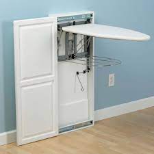 The cabinet houses an ironing board that is 11.75 x 41 in. Mom Of 6 Has The Most Efficient Laundry Room Ever Here S How She Does It Ironing Board Cabinet Ironing Board Paint Cabinets White