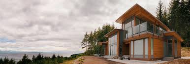 This post and beam home has an open floor plan which encompasses the living, dining room and kitchen. House Plans