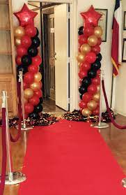 A red carpet prom begins with a grand entrance! Red Carpet Balloon Column Idea Red Party Decorations Red Carpet Theme Party Red Carpet Party