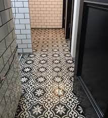 Black or white makes the tiles look different sizes.grey is the way to go. Favorite Black And White Cement Tile Installations Avente Tile