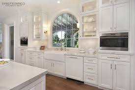 Our stock of cabinetry includes wall cabinets that hang above counters to store dishes, glasses, baking supplies, and more. White Kitchen With A Specialty Window Kitchen Design Kitchen And Bath Remodeling Kitchen