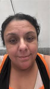 Empire State Building lit up in blue and green