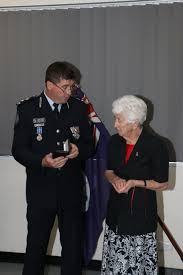Posthumous Award of National Police Service Medal and QPS Medal to fallen  officer's family