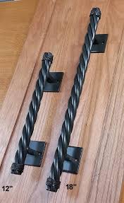 Custom ornamental iron works provides two styles of decorative door handles to meet the needs of your custom door project. Rustler 4 Rope Style Door Pull Barn Door Handle Pull Wild West Hardware