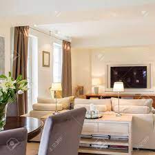 Please subscribe for stylish and simple interior design tips: Modern Living Room With Stylish Furniture And Tv Set Open To Dining Room With Table With Chairs Stock Photo Picture And Royalty Free Image Image 81575794