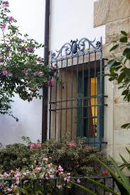 Antique arts and crafts mission 4 arm wrought iron chandelier. Wrought Iron Window Grill Detail Stock Photo Image Of Decoration Close 105564574