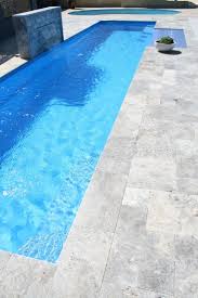 21 Best Swimming Pool Designs Beautiful Cool And Modern Stone Pool Deck Stone Pool Swimming Pool Landscaping