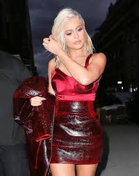 Stylish blonde in long red dress is sitting on luxurious sofa. Kylie Jenner Is Red Hot In New York As She Shows Off Dramatic Platinum Locks Mirror Online
