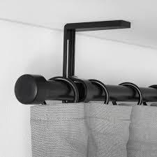 Before you hang curtains from the top of your wall (near the ceiling), you might want to gain from my experience: Betydlig Wall Ceiling Bracket Black Ikea