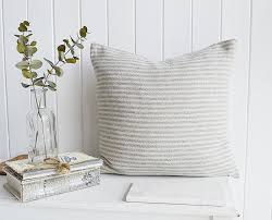 With a deep navy and soft whites, this piece can be placed within a variety of different style environments. Hampshire Navy And Ivory Check And Striped Cushions