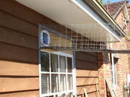 It is accessed from the house through a cat flap in the window, so cats have access to inside and outside. Cat Enclosures