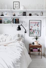To Add Storage Space To A Small Bedroom Install Shelves Above The Bed To Display Collectibles Or Art Or Hold Remodel Bedroom Small Bedroom Shelves In Bedroom