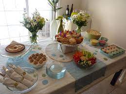 How To Host A Fake Baby Shower Baby Shower Food Table Decorations Baby Shower Host Baby Shower Buffet