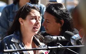 Flag ceremony, art exhibit help raise awareness about domestic violence